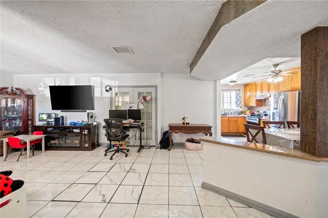 a living room with lots of furniture and a flat screen tv