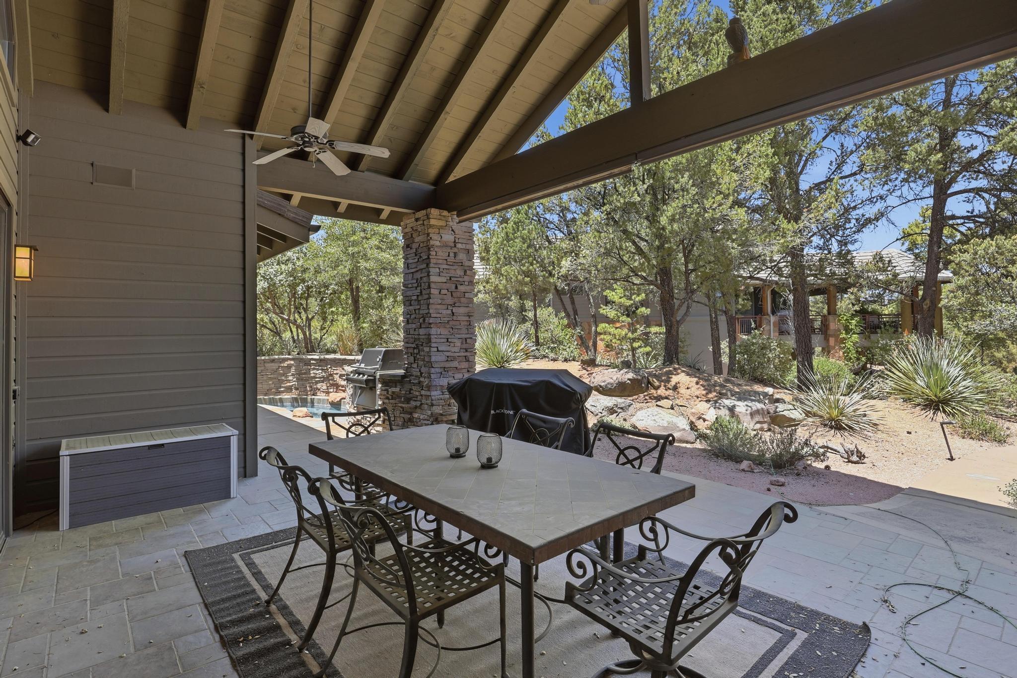 2908 East Rim Club Drive Payson, AZ 85541 - Photo 60 of 77 a view of a patio with a table and chairs