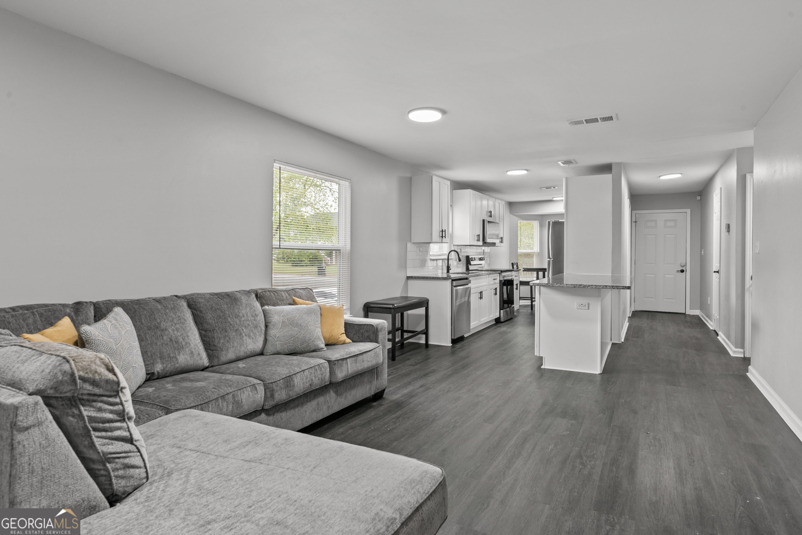 140 Cumberland Court Athens, GA 30607 - Photo 11 of 19 a living room with furniture and kitchen view with wooden floor