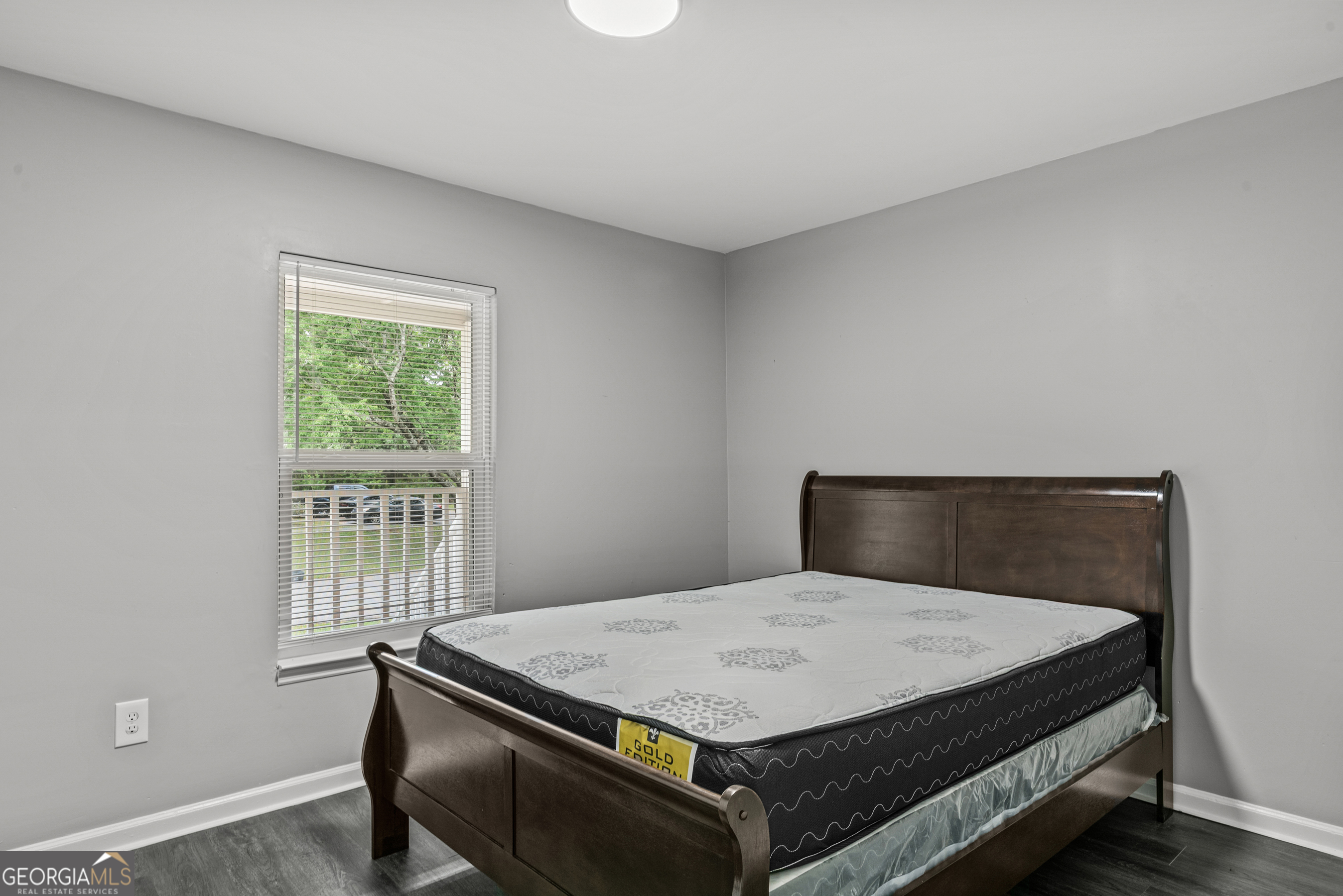 140 Cumberland Court Athens, GA 30607 - Photo 17 of 19 a bed sitting in a bedroom next to a window