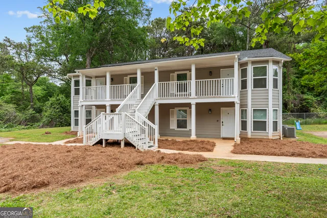 front view of a house with a yard