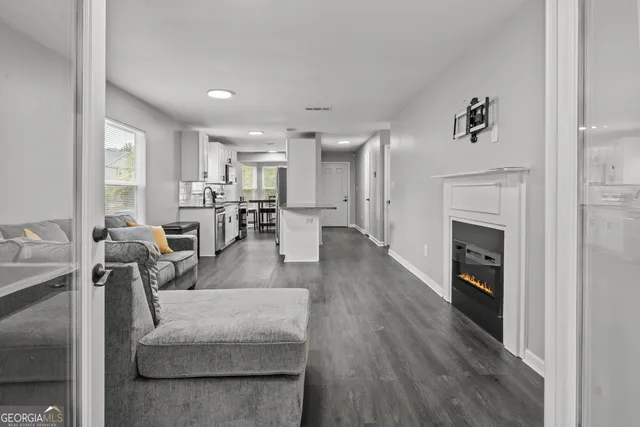 a living room with furniture and a fireplace
