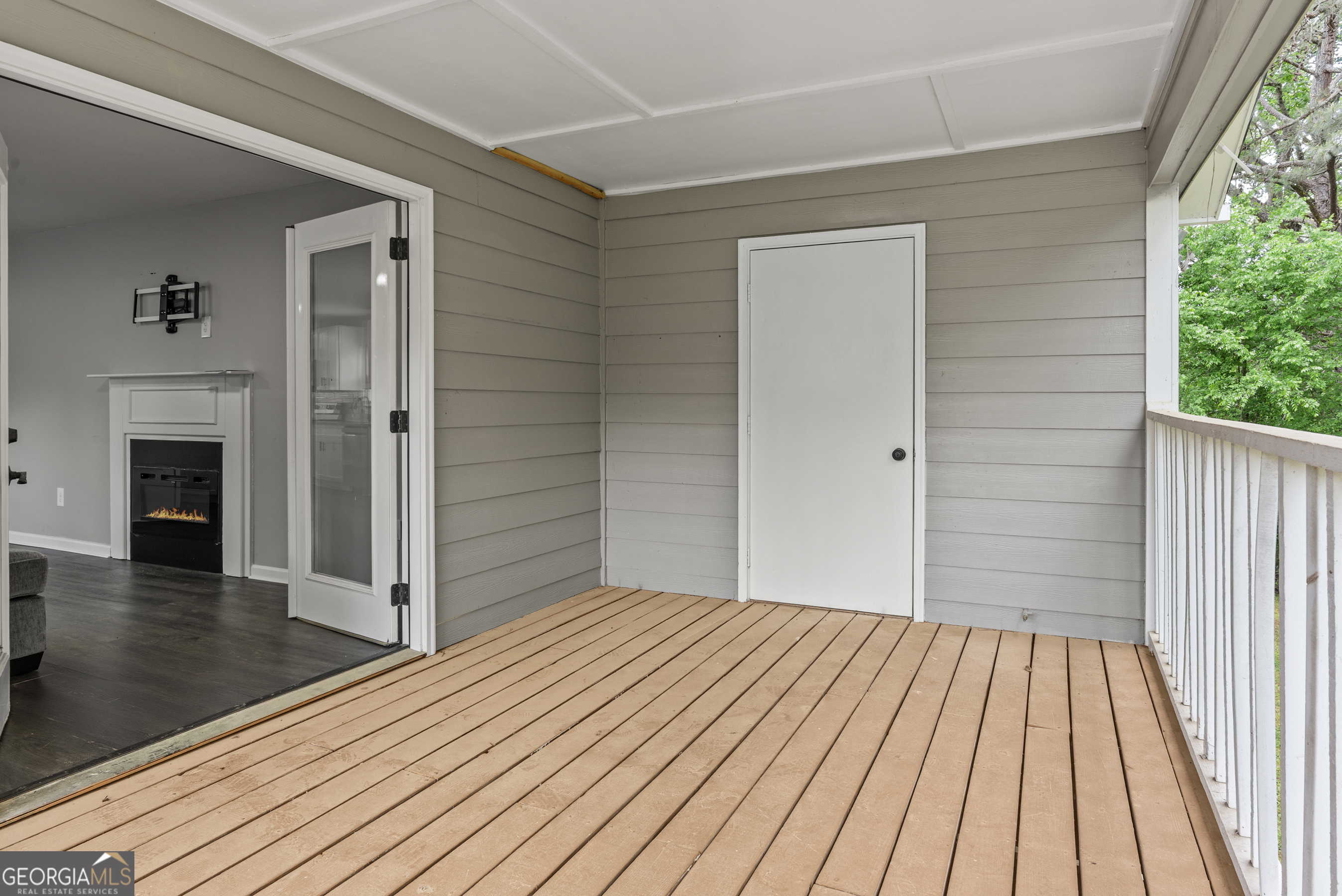 140 Cumberland Court Athens, GA 30607 - Photo 10 of 19 an empty room with wooden floor a fireplace and windows