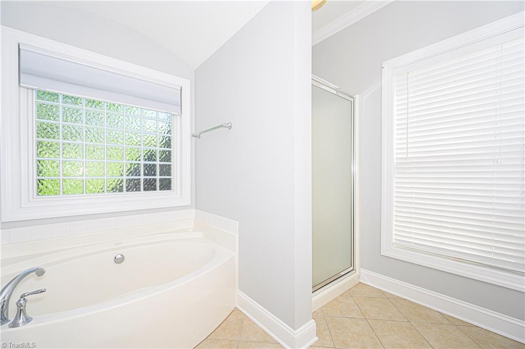 1489 Downington Road Clemmons, NC 27012 - Photo 18 of 25 This master bath has a great feel with it's separate tub and shower, double vanity, and natural light.