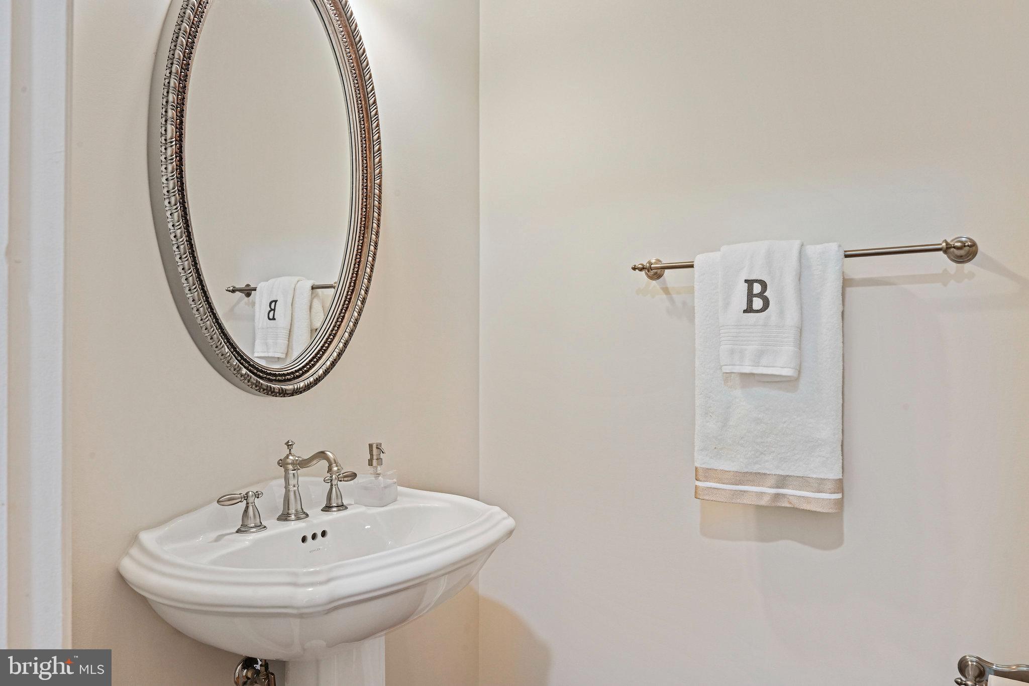 8424 Falcone Pointe Way Vienna, VA 22182 - Photo 14 of 71 a bathroom with a sink a mirror and a mirror