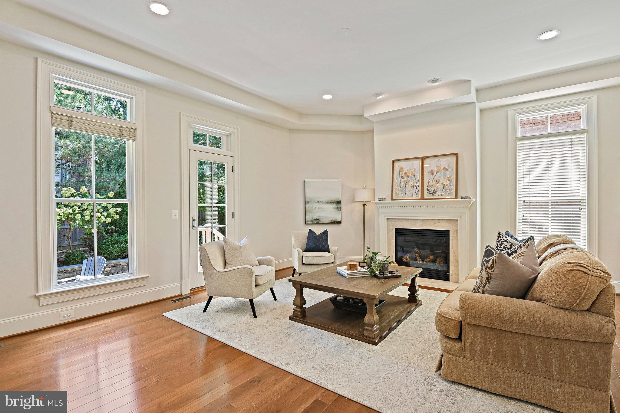8424 Falcone Pointe Way Vienna, VA 22182 - Photo 15 of 71 a living room with furniture and a fireplace