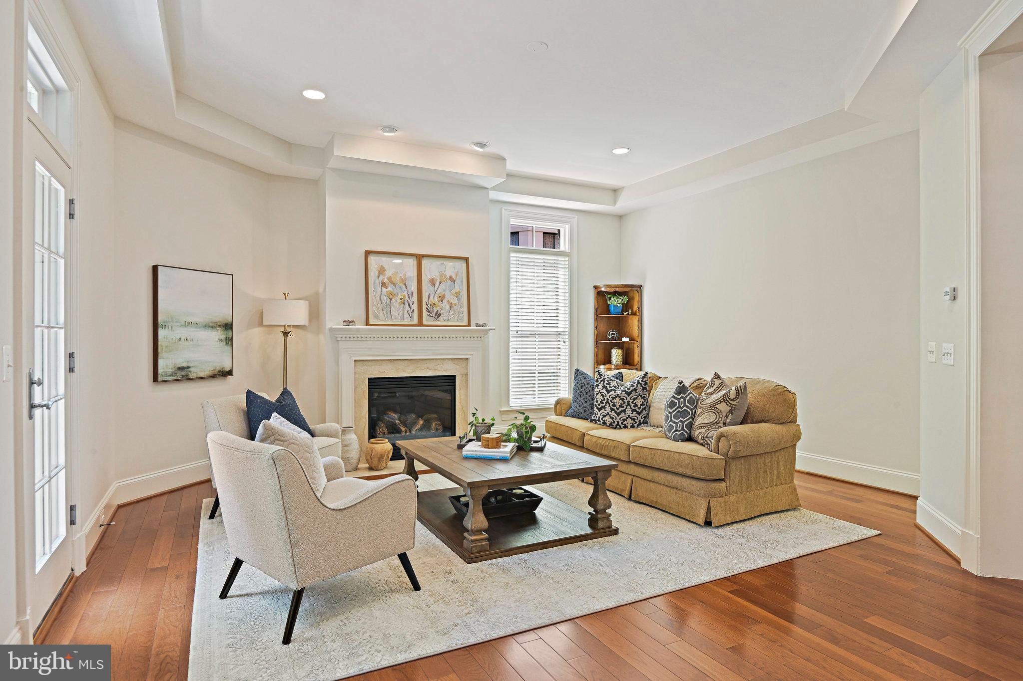 8424 Falcone Pointe Way Vienna, VA 22182 - Photo 16 of 71 a living room with furniture and a fireplace