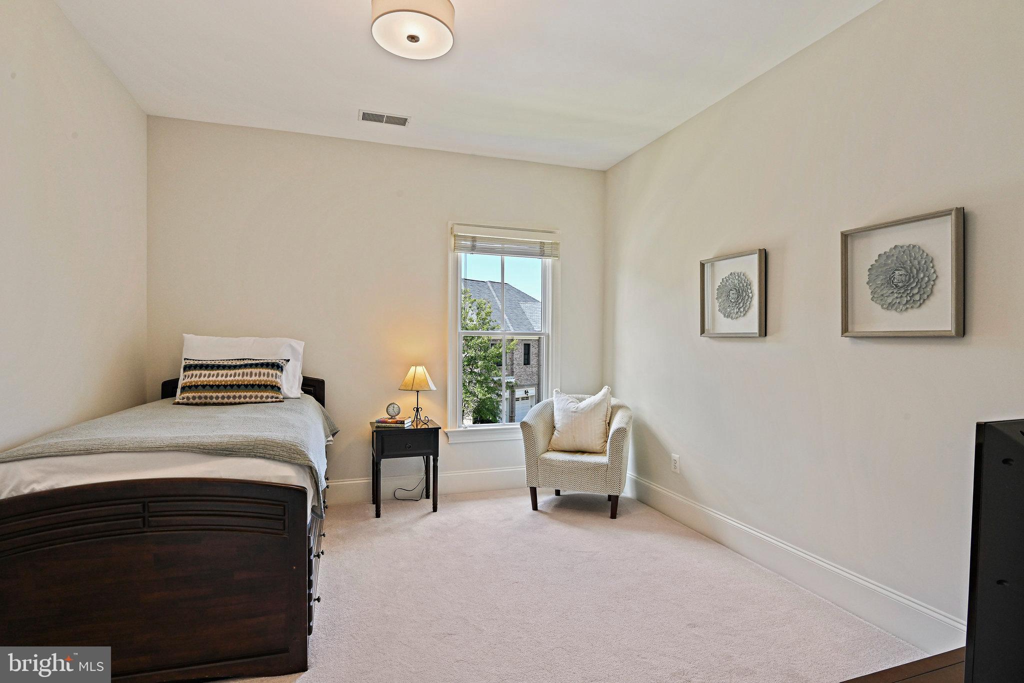 8424 Falcone Pointe Way Vienna, VA 22182 - Photo 25 of 71 a bedroom with a bed and a couch