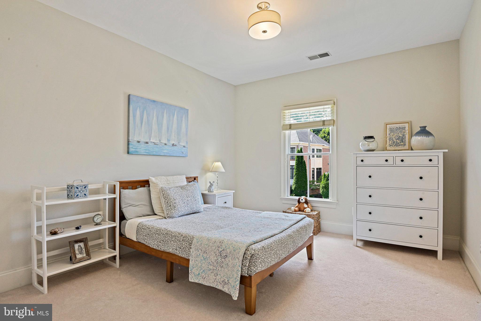 8424 Falcone Pointe Way Vienna, VA 22182 - Photo 36 of 71 a bedroom with a bed and a cabinets