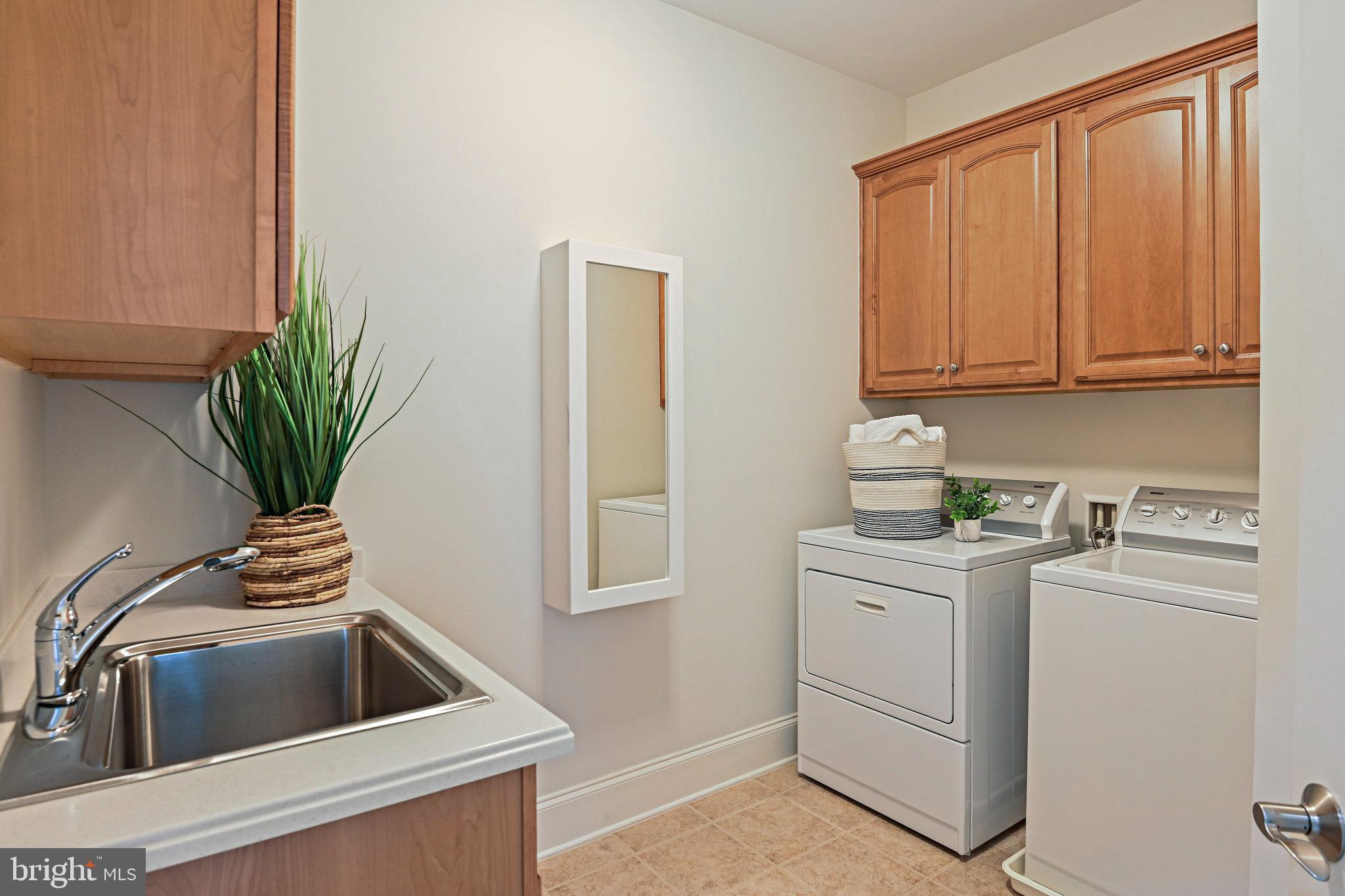 8424 Falcone Pointe Way Vienna, VA 22182 - Photo 39 of 71 a kitchen with a refrigerator sink and cabinets