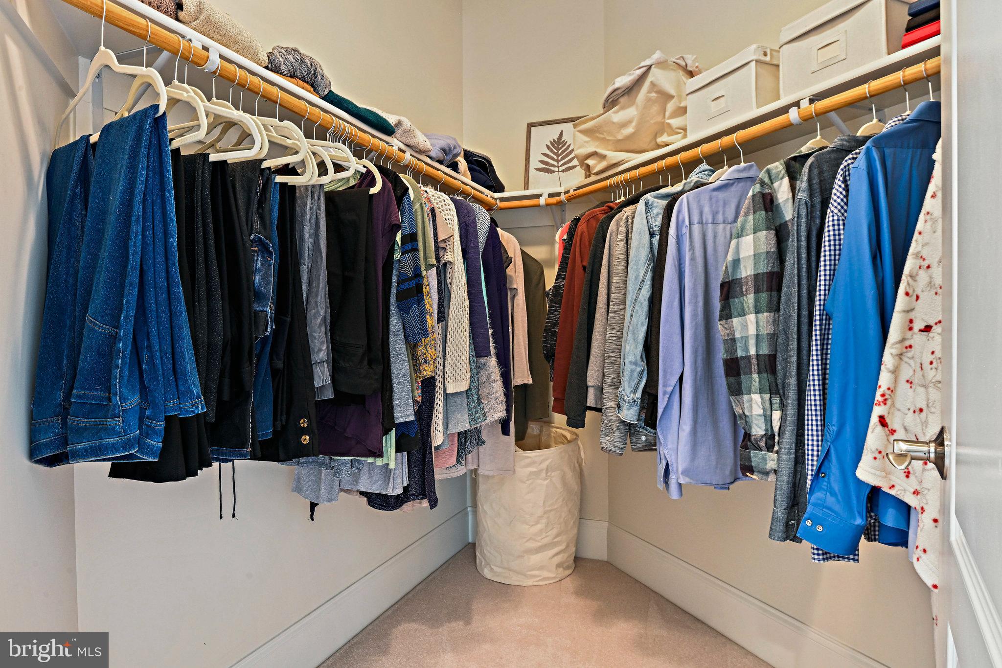 8424 Falcone Pointe Way Vienna, VA 22182 - Photo 47 of 71 a view of walk in closet with clothes and shoes