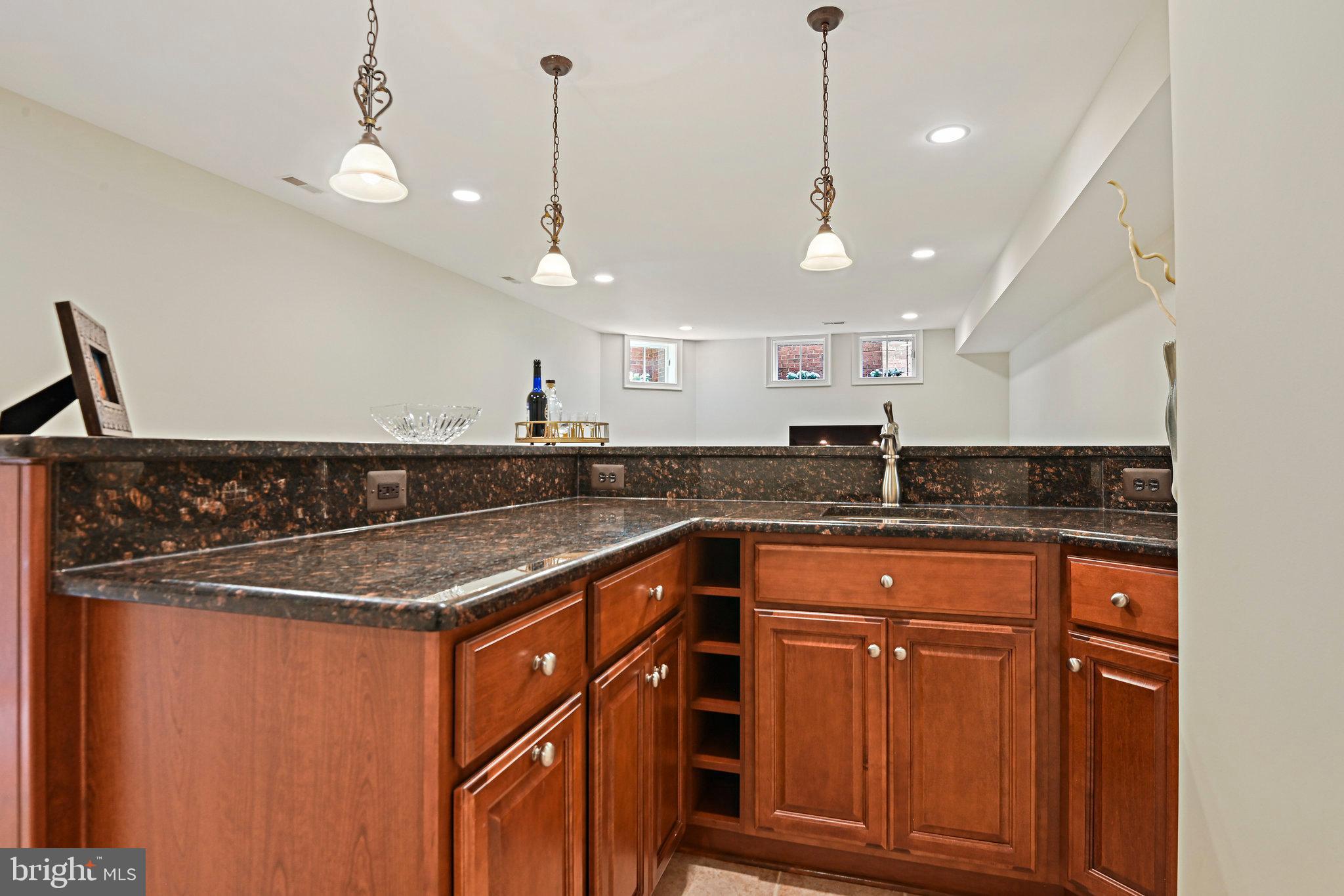 8424 Falcone Pointe Way Vienna, VA 22182 - Photo 64 of 71 a kitchen with stainless steel appliances granite countertop a sink a refrigerator and a granite counter tops