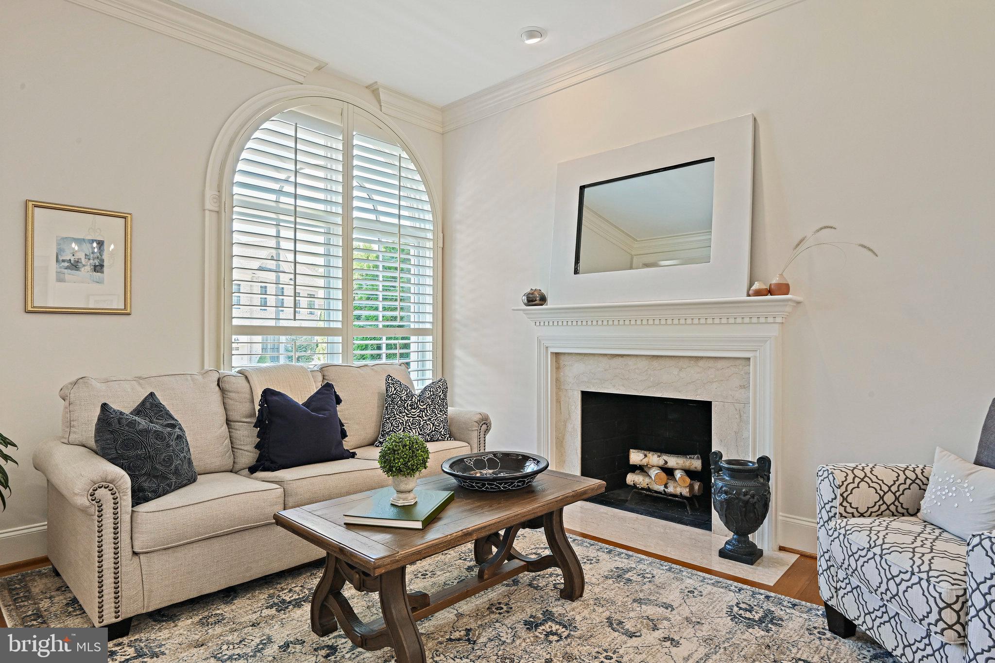 8424 Falcone Pointe Way Vienna, VA 22182 - Photo 7 of 71 a living room with furniture and a fireplace