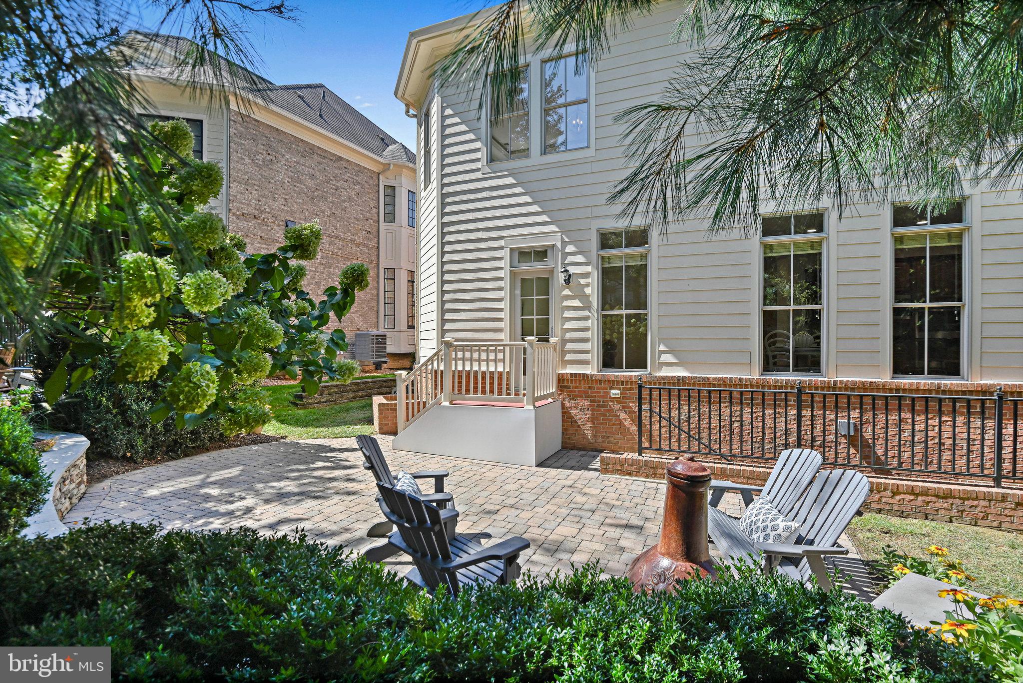 8424 Falcone Pointe Way Vienna, VA 22182 - Photo 71 of 71 a view of a chair and table in backyard of the house