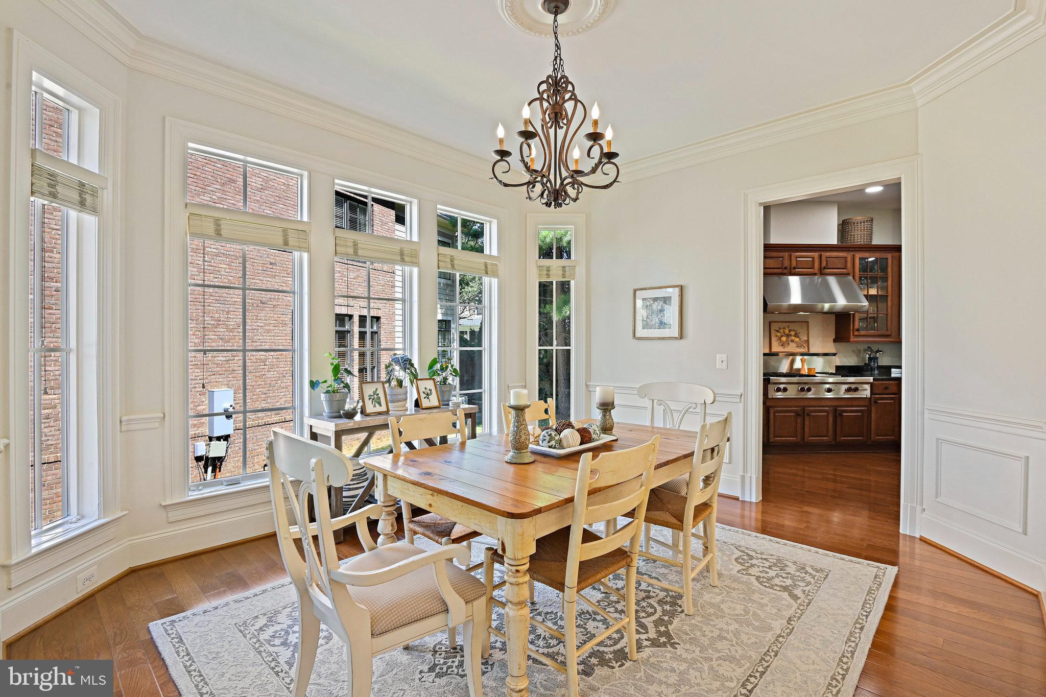 8424 Falcone Pointe Way Vienna, VA 22182 - Photo 9 of 71 a view of a dining room with furniture wooden floor and chandelier