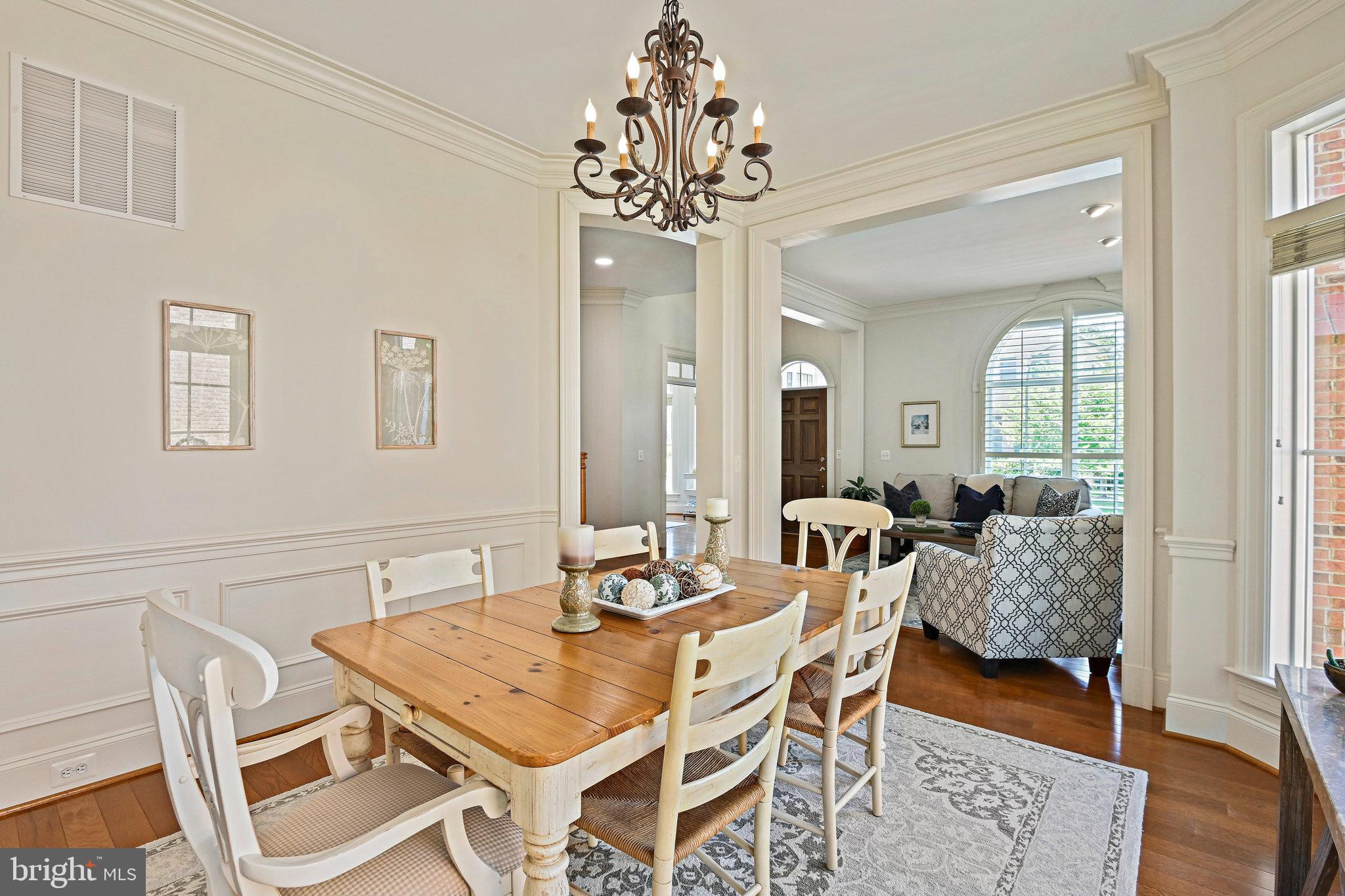 8424 Falcone Pointe Way Vienna, VA 22182 - Photo 10 of 71 a view of a dining room with furniture and wooden floor