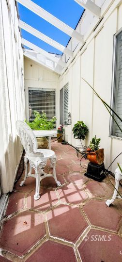 548 South Sanders Street Ridgecrest, CA 93555 - Photo 10 of 29 a view of a patio with table and chairs potted plants
