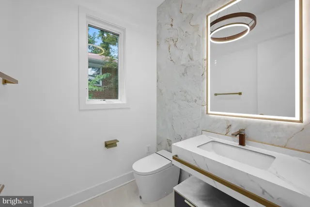 a view of a balcony with flower plants