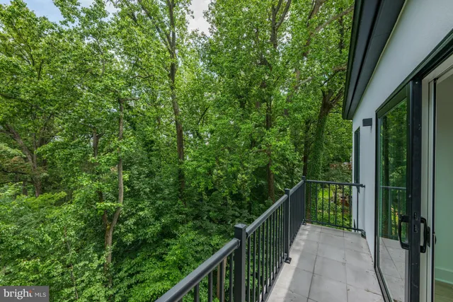 a view of a kitchen with large windows and a counter top space