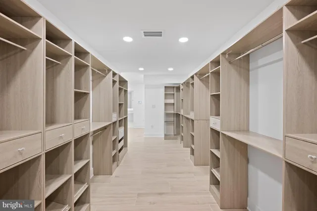 a view of kitchen with stainless steel appliances a refrigerator and a counter top space