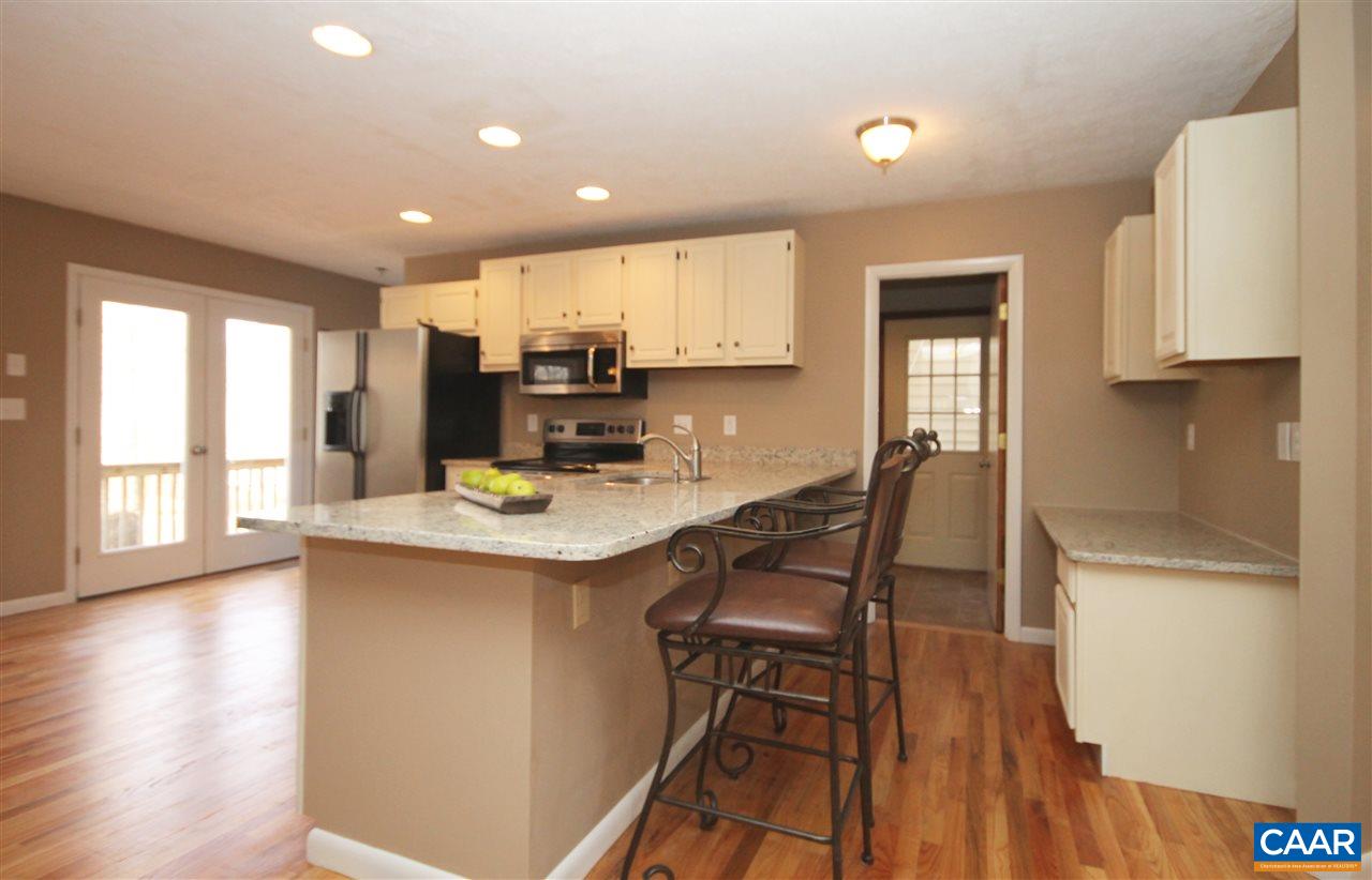 20 Hardwood Road Palmyra, VA 22963 - Photo 9 of 23 Lightfilled Kitchen opens to Living room and dining room.