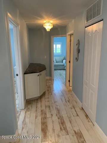 a bedroom with two beds and a window