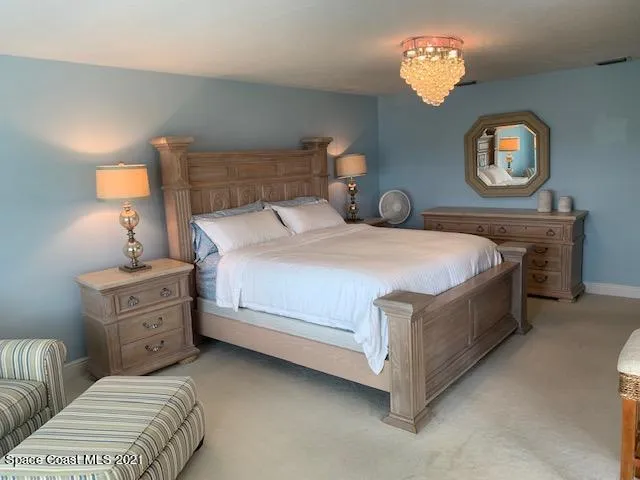 a view of a chairs and table in the balcony
