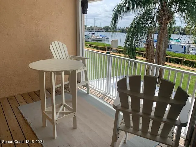 a view of swimming pool with outdoor seating and deck