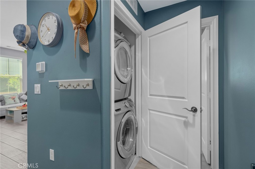 4171 South Cardinale Privado, Unit 2 Ontario, CA 91761 - Photo 11 of 30 a view of a storage and utility room with washer and dryer