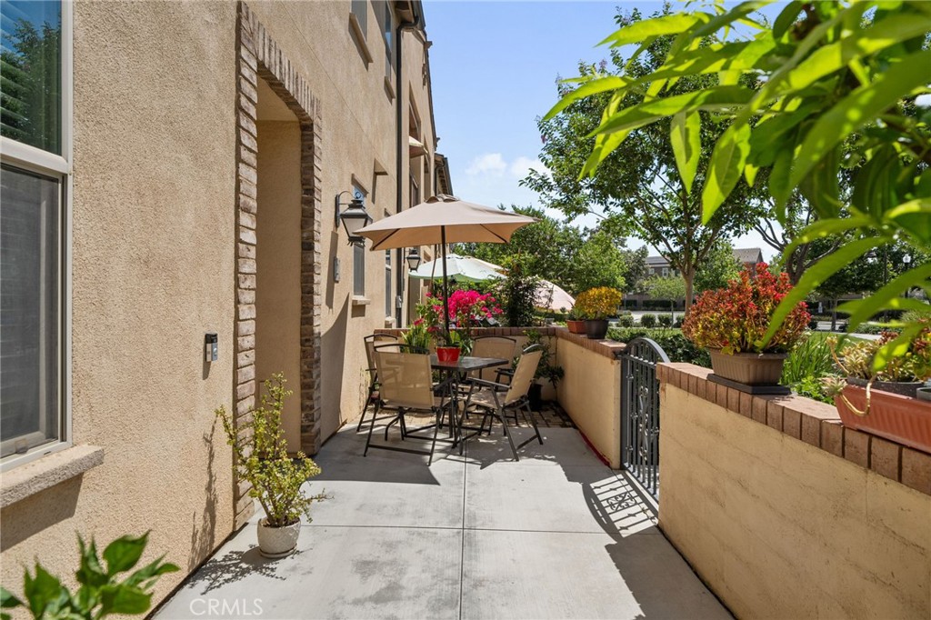 4171 South Cardinale Privado, Unit 2 Ontario, CA 91761 - Photo 24 of 30 a view of a patio with chairs and potted plants