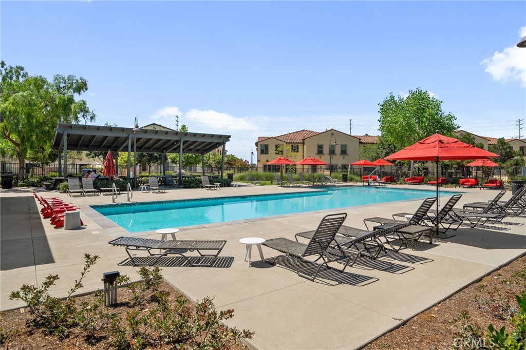 4171 South Cardinale Privado, Unit 2 Ontario, CA 91761 - Photo 29 of 30 an outdoor space with furniture and umbrella