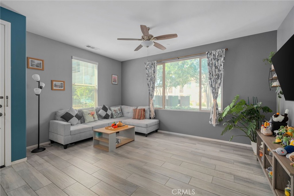 4171 South Cardinale Privado, Unit 2 Ontario, CA 91761 - Photo 3 of 30 a living room with furniture and a large window