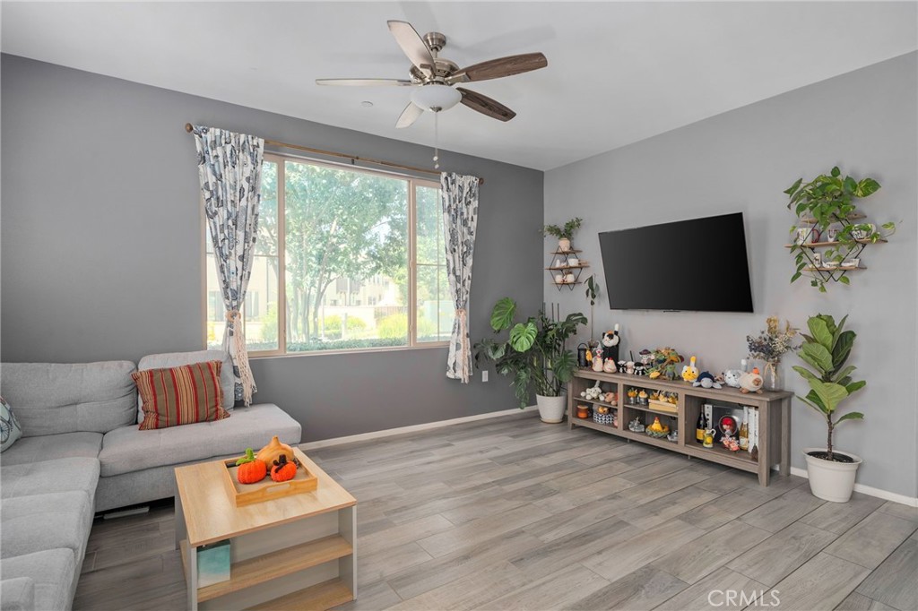 4171 South Cardinale Privado, Unit 2 Ontario, CA 91761 - Photo 4 of 30 a living room with furniture and a flat screen tv