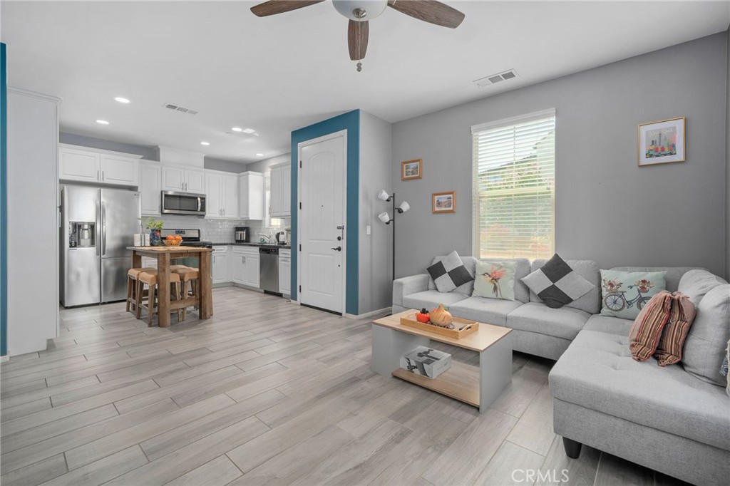4171 South Cardinale Privado, Unit 2 Ontario, CA 91761 - Photo 5 of 30 a living room with furniture and kitchen view