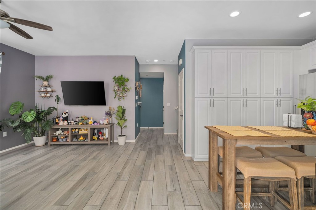 4171 South Cardinale Privado, Unit 2 Ontario, CA 91761 - Photo 6 of 30 a view of a livingroom with furniture and wooden floor