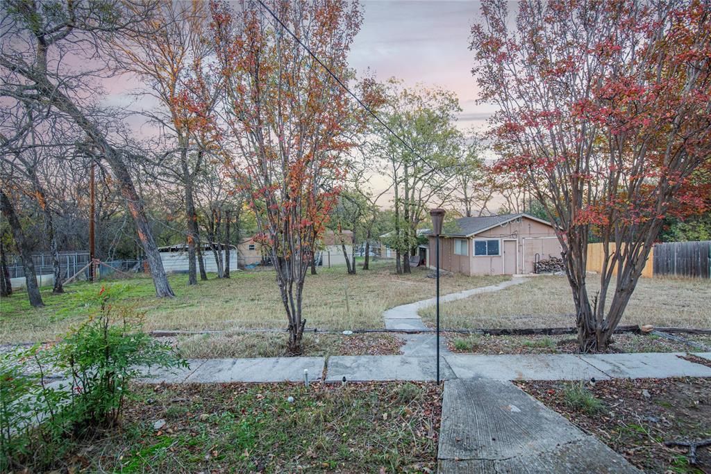 905 Martha Lane Azle, TX 76020 - Photo 2 of 18 View of yard at dusk