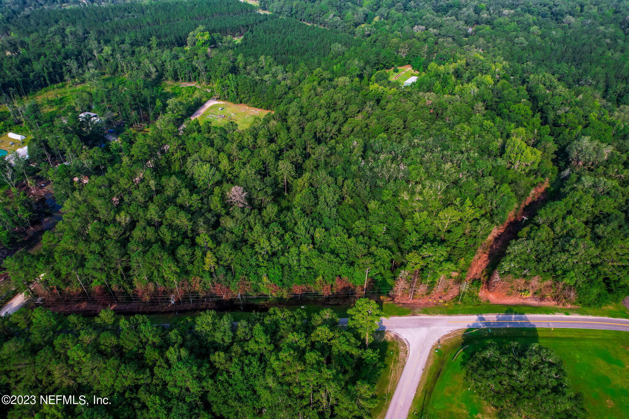 0 Middle Road Hilliard, FL 32046 - Photo 18 of 19 a view of a garden with plants and large trees