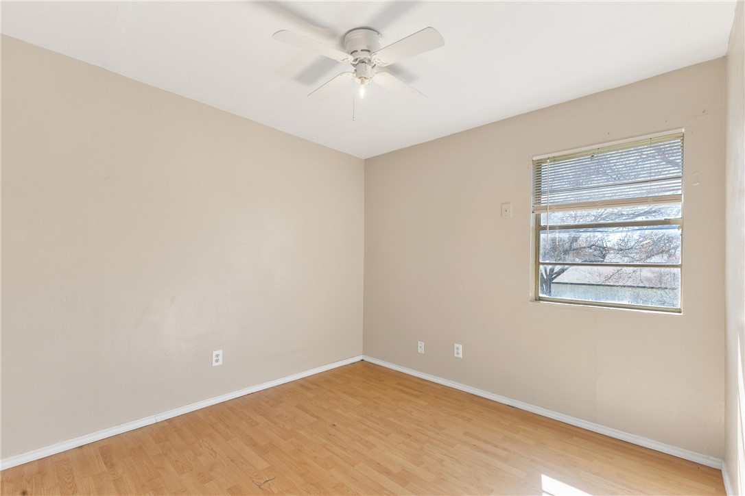 2802 Cypress Bend Circle Bryan, TX 77801 - Photo 6 of 15 an empty room with windows and fan