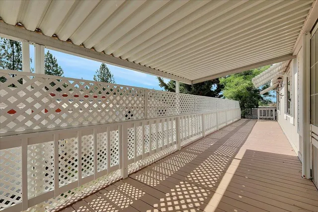 a view of a balcony with wooden fence