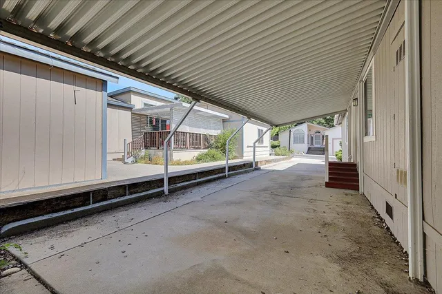 a view of a house with backyard and a garage