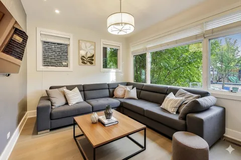 a bathroom with a sink mirror and toilet