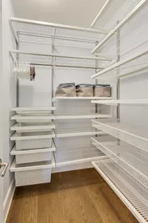 a bedroom with a bed and a walk in closet