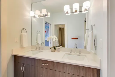 a utility room with stainless steel appliances and cabinets