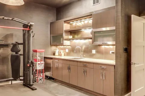 a view of a backyard with a slide trees and wooden fence