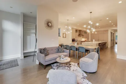 a kitchen with stainless steel appliances kitchen island granite countertop a kitchen island a stove and a sink