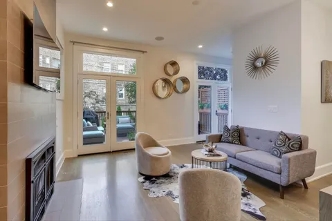 a view of a dining room with furniture and wooden floor