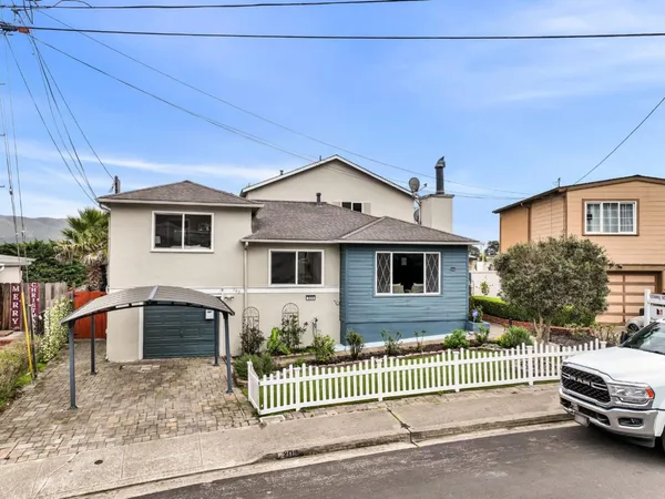 a front view of a house with a garage