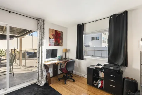 a living room with furniture and kitchen view