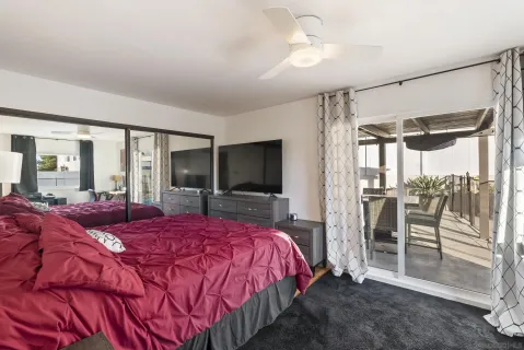 a kitchen with stainless steel appliances granite countertop a refrigerator a sink dishwasher a stove and white cabinets with wooden floor