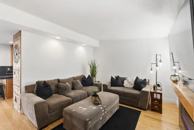 a bathroom with a toilet sink vanity and shower